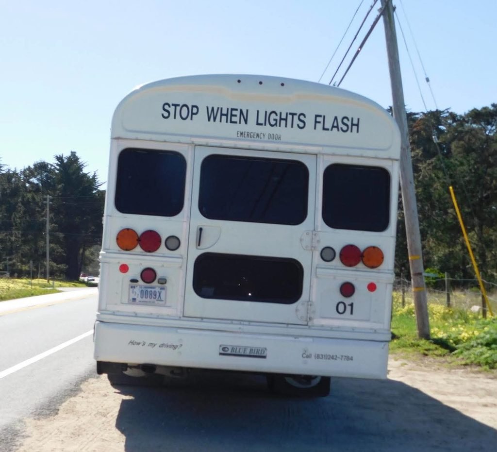 A bus parked outside of Point Lobos Natural Reserve